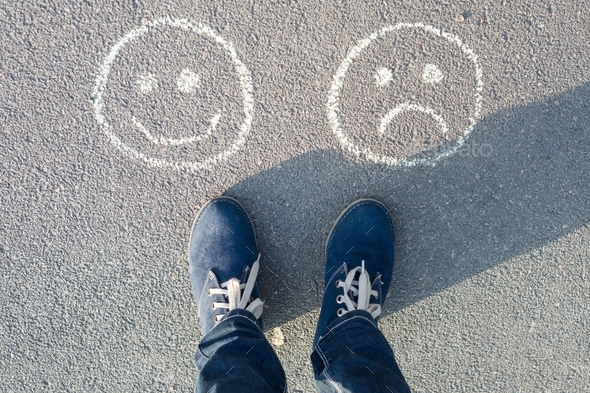 Happy Smileys or Unhappy, text on asphalt road