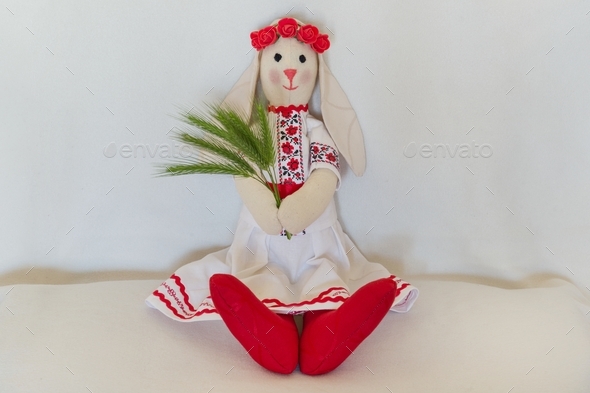 Doll in the national Ukrainian folk costume, keeps the spikelets.