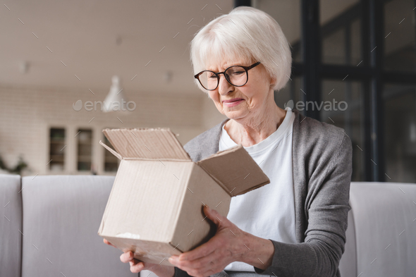 Grandmother opening wrong parcel, delivery post mistake, internet fraud, bad quality of goods