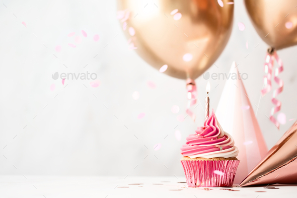 Birthday celebration with cupcake and balloons