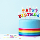 Birthday cake with rainbow birthday candles and ribbon - PhotoDune Item for Sale