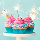 Three celebration cupcakes with pink frosting and sparklers - PhotoDune Item for Sale