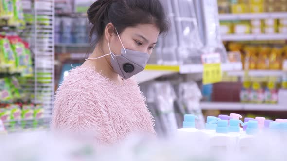 New normal lifestyle Asian mature adult female woman shopping in supermarket alt