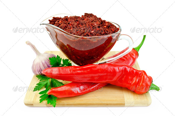 Ajika in a glass gravy boat - Stock Photo - Images