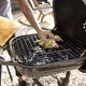 Midsection Of Man Grilling Fish On Barbecue At Yard - PhotoDune Item for Sale