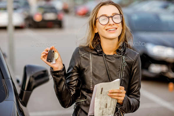 Woman renting a car - Stock Photo - Images