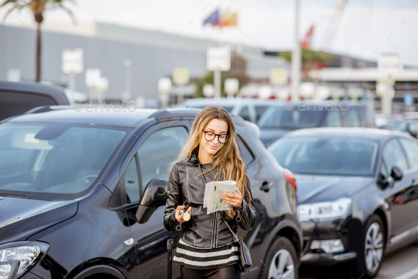 Woman renting a car - Stock Photo - Images