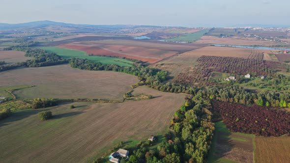 Flight over the fields behind the western Ukrainian village Aerial view.