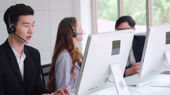 Business People Wearing Headset Working in Office alt