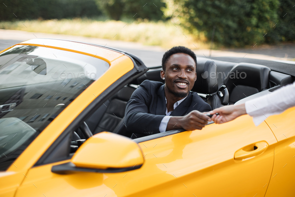 African businessman in a Car Rental Service - Stock Photo - Images