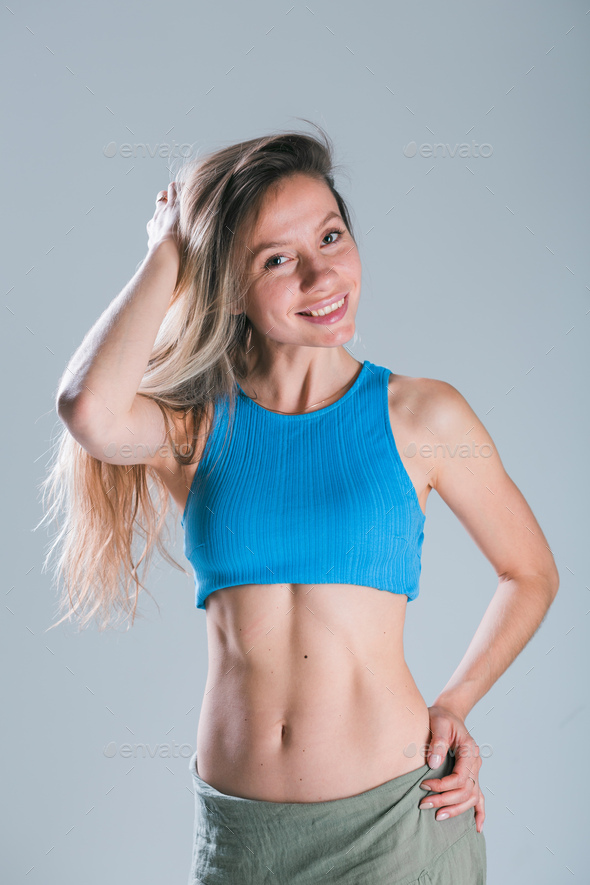 Premium Photo  Cropped shot of a young slim woman with toned stomach  demonstrating her abs result of fitness diet