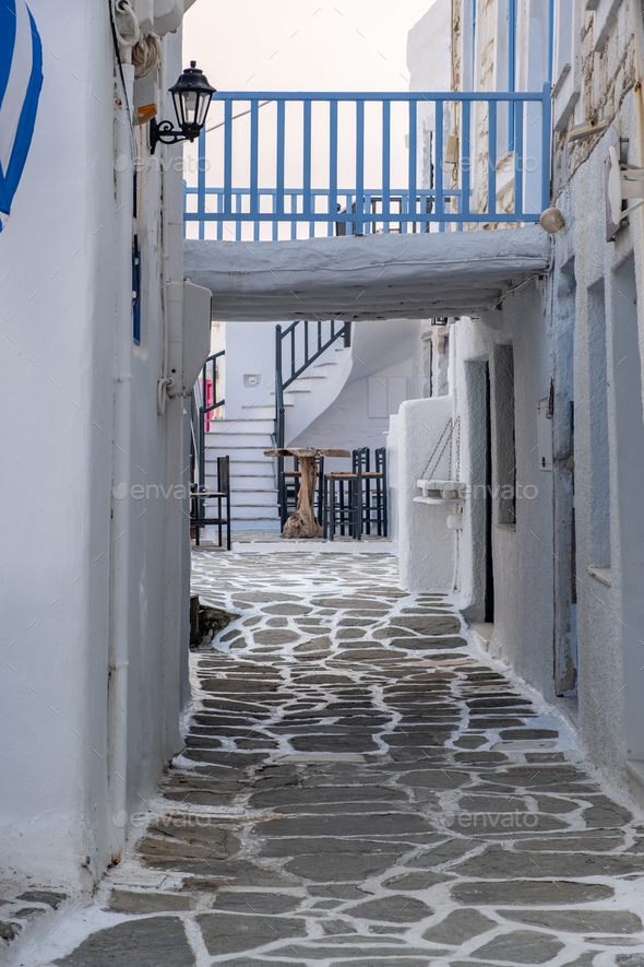 Cafe tavern outdoor at Paros island Naousa village Cyclades summer destination Greece. Vertical