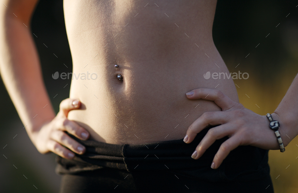 Girl belly with piercing