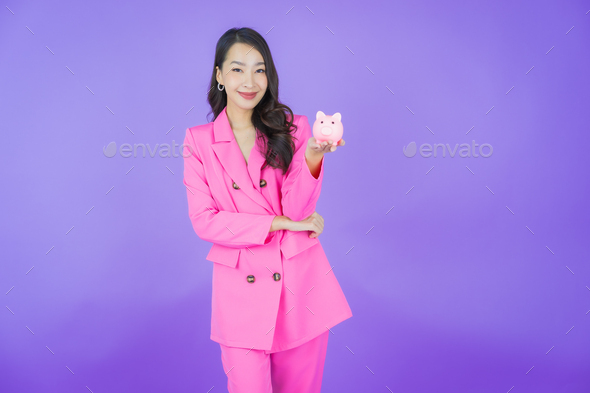 Portrait beautiful young asian woman with piggy bank - Stock Photo - Images
