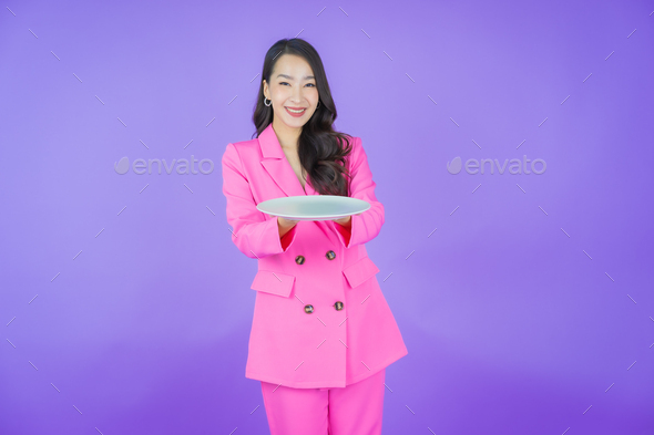 Portrait beautiful young asian woman smile with empty plate dish - Stock Photo - Images