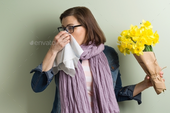 Spring allergy to pollen. Woman with bouquet