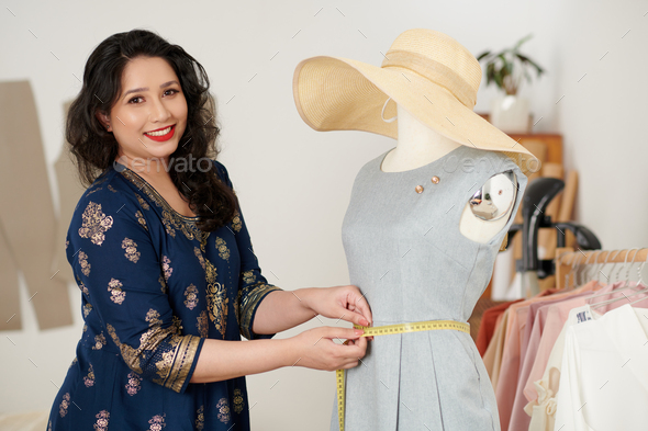 Tailor Measuring Dress on Mannequin