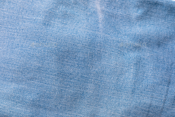 Blue jeans fabric background texture. Ripped denim textile, text place,  copy space. Stock Photo by IaroshenkoM