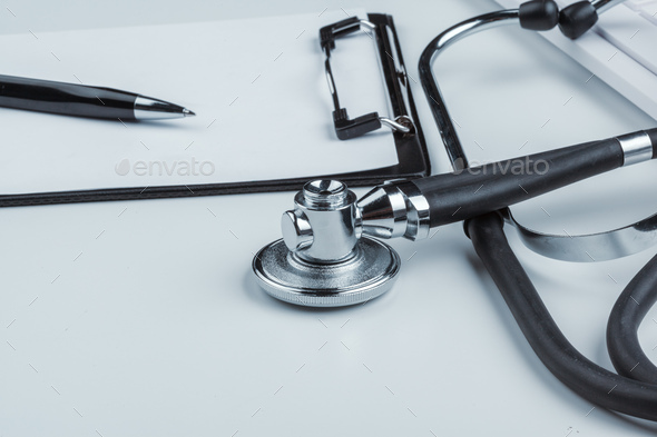 blank clipboard with modern stethoscope - Stock Photo - Images