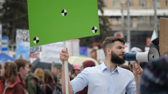 Man at Political Meeting with Banner with Points for Tracking To Copy Space Text alt