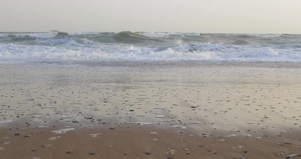 Soft Wave of the Sea on the Sandy Beach with White Clean Foam