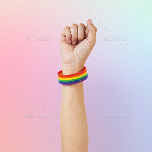 LGBTQ+ pride bracelet with fist in the air