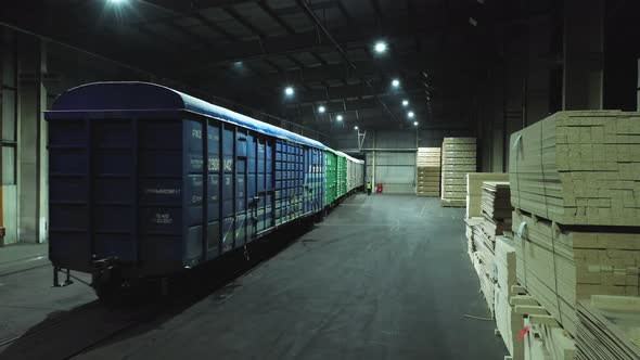 A Freight Train Departs From the Warehouse of the Woodworking Plant