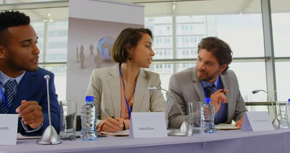 Business people sitting at the speaker table in seminar 4k alt