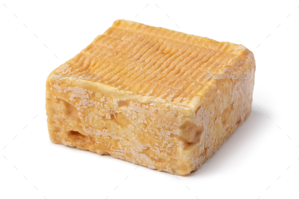 Single whole piece of Limburger or Herve cheese on white background