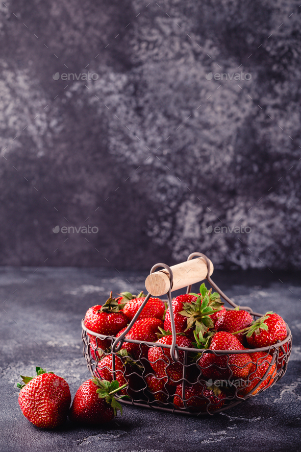 Fresh tasty delicious strawberry on a dark background - Stock Photo - Images