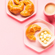 Coffee and croissants for breakfast on a pink background - PhotoDune Item for Sale