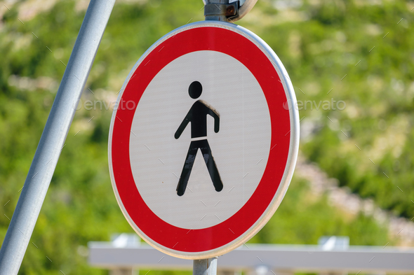 Traffic sign prohibited entry for people depicting a walking person inside a red circle