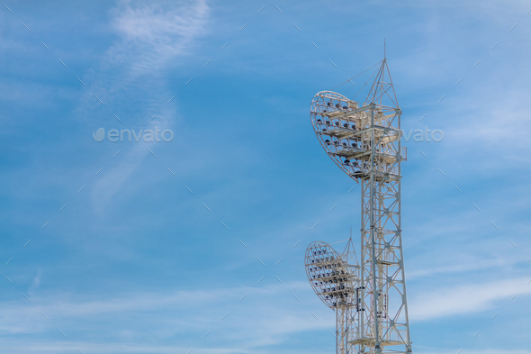Stadium light against blue sky. Sports architecture and equipment - Stock Photo - Images