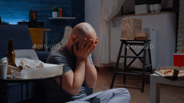 Hopeless man overwhelmed caused by digital eviction notice