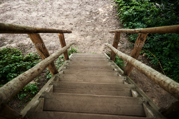 Wooden stairs for descent down and rise up. Old wooden steps