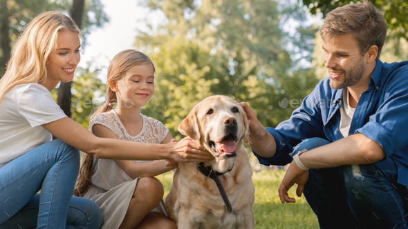 Close up shot of happy parents with their little girl having fun with ...