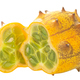 Kiwano or Horned Melon isolated.  Ripe cut Cucumis metuliferus pepo fruit - PhotoDune Item for Sale