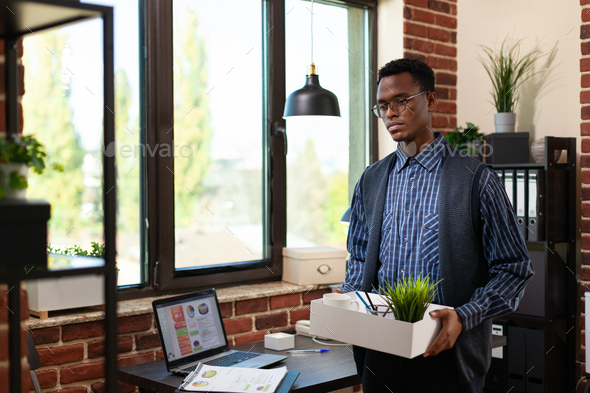 African american entrepreneur with glasses quitting his job having career problems