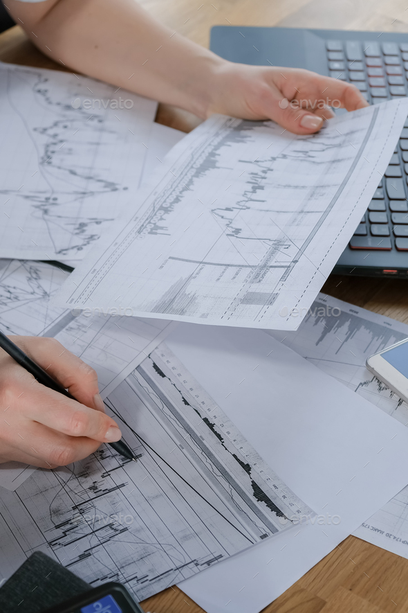 Investments. Young woman investor buys stocks on the stock exchange stock market - Stock Photo - Images