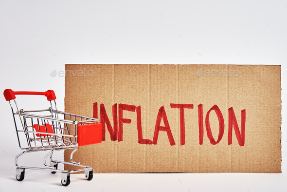 Consumers inflation concept, shopping trolley and word inflation - Stock Photo - Images