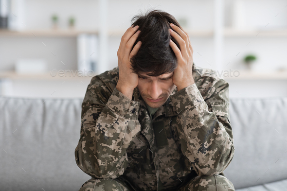 Depressed military man covering his head with palms Stock Photo by ...