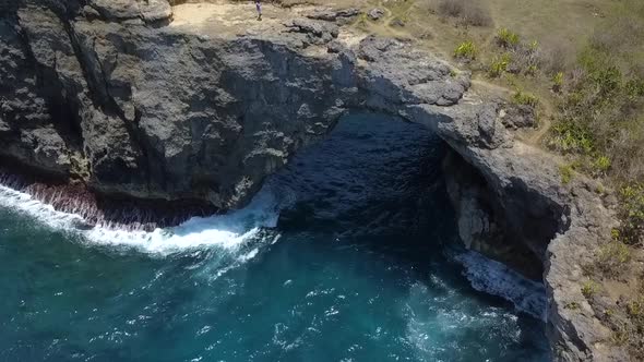 Gorgeous aerial view flight drone shot from above of natural bridge atBroken Beach at Nusa Penida B alt