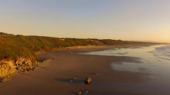 Aerial footage drone flying forwards over Whiskey Run, a beach near Bandon at the Southern Oregon co alt