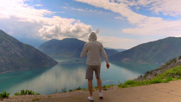 Sportive Man Running and Enjoying Beautiful Nature Scenery alt