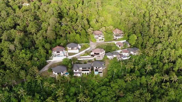 Beautiful Drone View of Luxury Villas Located on Green Mountain Range on Tropical Paradise Island
