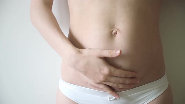 Closeup of Woman Belly with Scar From a Cesarean Section alt