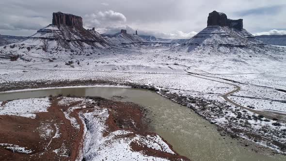 Flying over the Colorado River through winter landscape in Castle Valley alt
