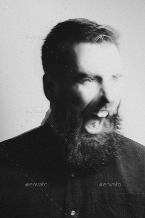 Black and white double exposition portrait of a hipster man screaming mental health concept
