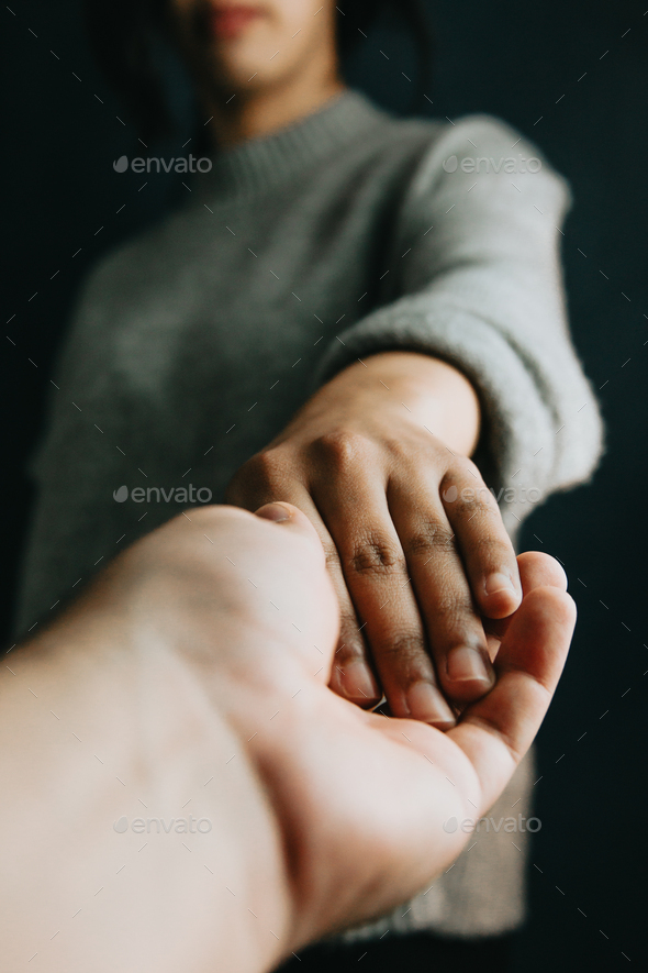 Man and woman holding hands, help and self help concept, mental health