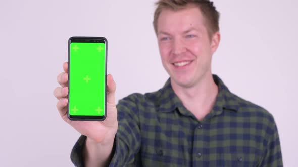 Young Man Showing Phone with Green Screen with Various Emotions alt